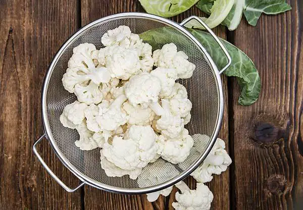 fresh cauliflower in strainer